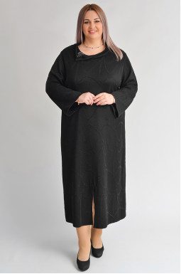 Чорна сукня з делікатним люрексовим мерехтінням і декоративною брошкою великих розмірів