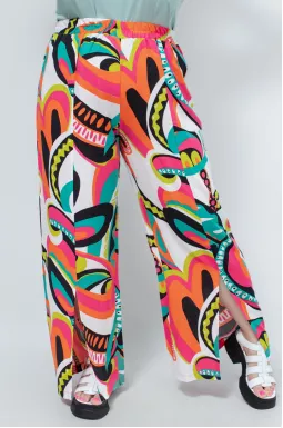 Яркие штапельные брюки клеш с разрезами батал