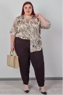 Однотонні брюки банани з акцентними манжетами великих розмірів