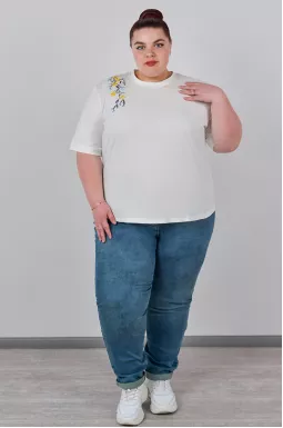 Джинси завужені з декоративними елементами великих розмірів