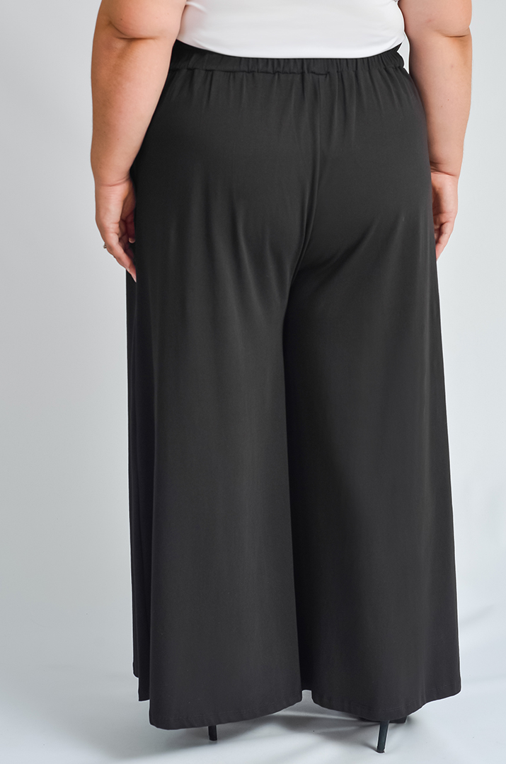 Однотонні брюки палаццо з кишенями великих розмірів