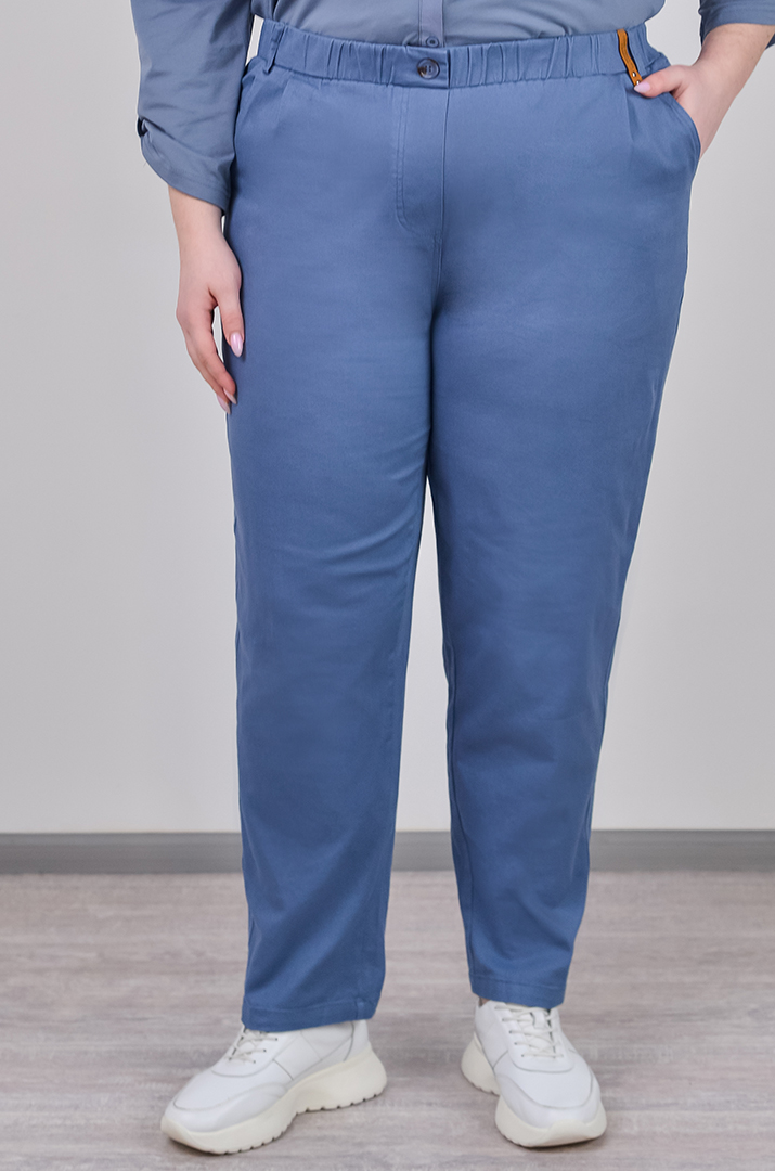 Завужені джинси з еластичним поясом і декоративним ґудзиком великих розмірів