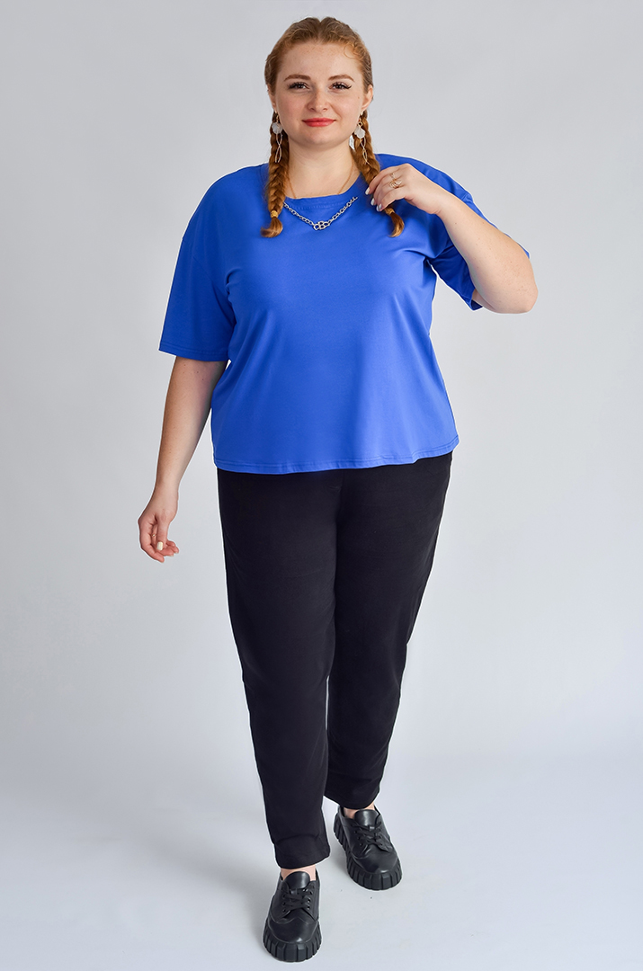 Завужені джинси з еластичним поясом і декоративним ґудзиком великих розмірів