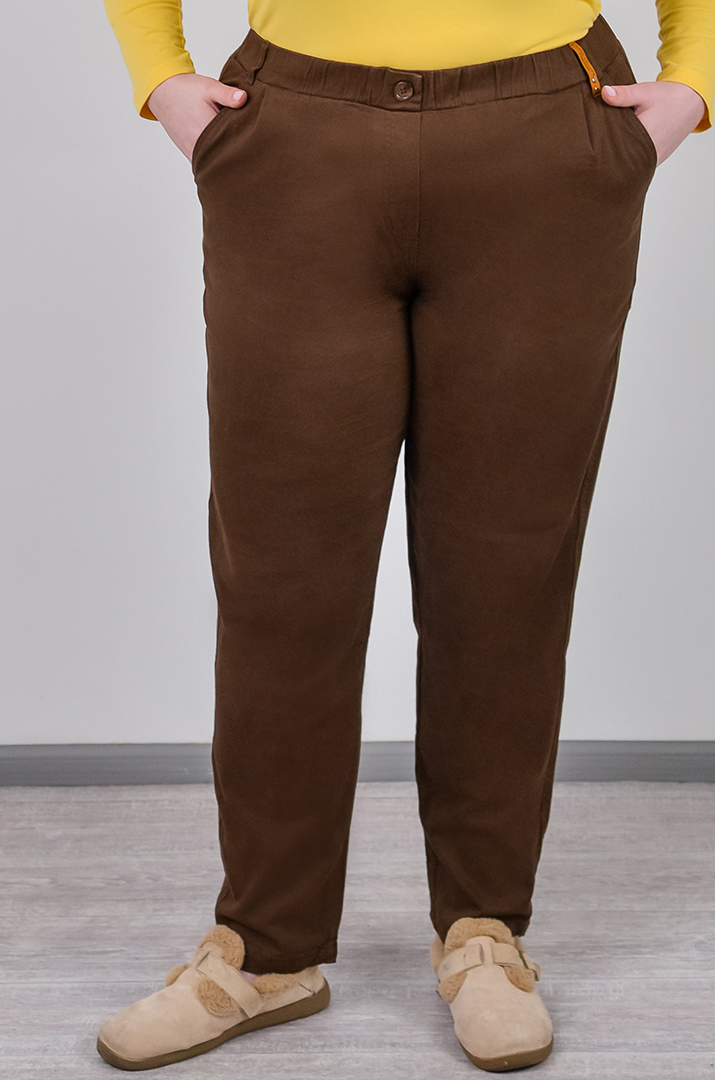 Завужені джинси з еластичним поясом і декоративним ґудзиком великих розмірів