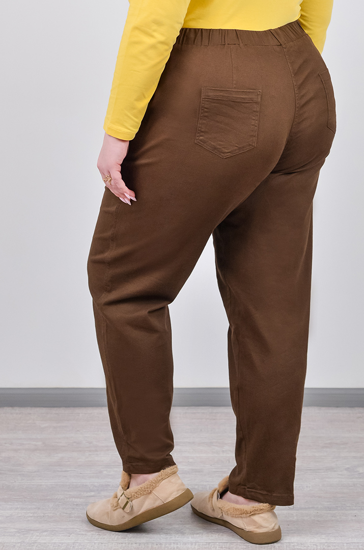 Завужені джинси з еластичним поясом і декоративним ґудзиком великих розмірів