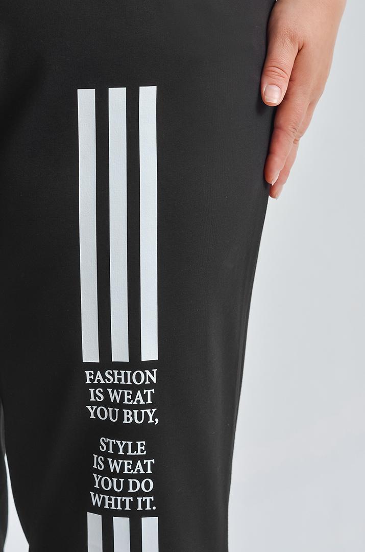 Завужені чорні брюки з білими акцентами великих розмірів