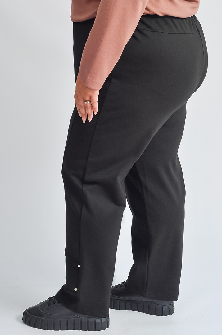 Завужені брюки з декоративними складками великих розмірів