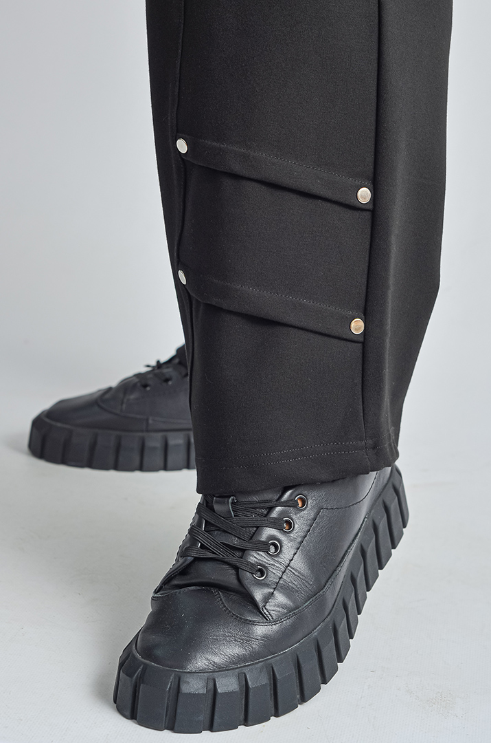 Завужені брюки з декоративними складками великих розмірів