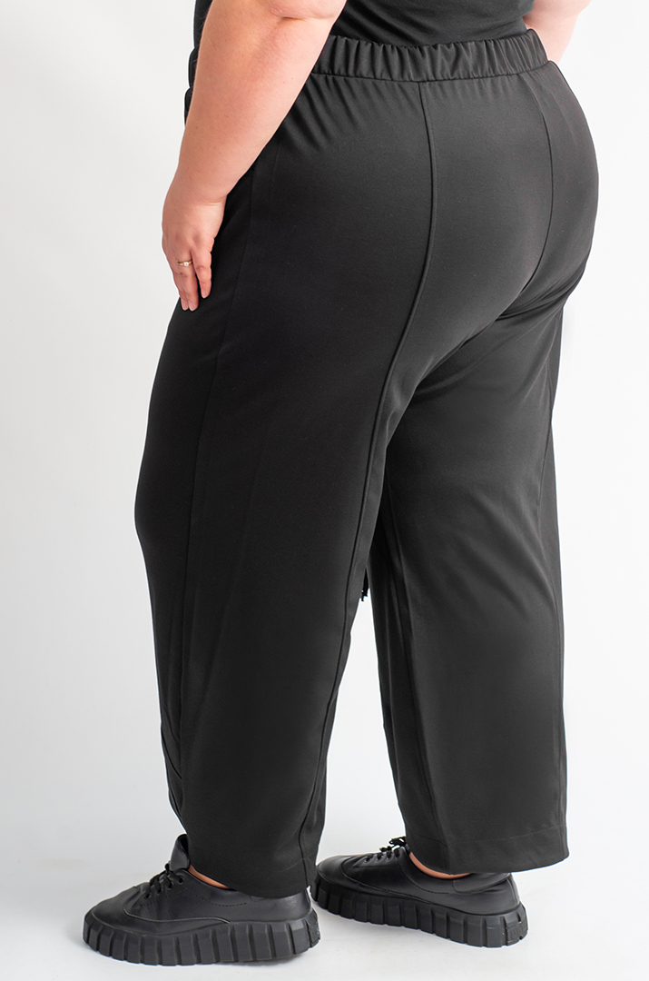 Брюки банани з кишенями та декоративними блискавками великих розмірів