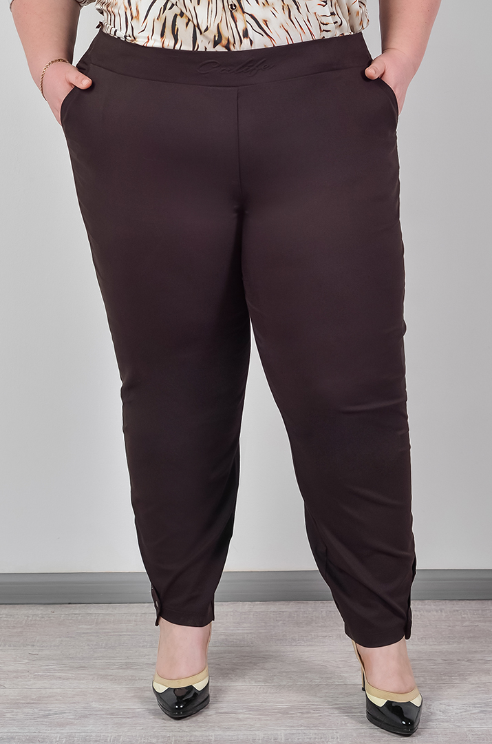 Однотонні брюки банани з акцентними манжетами великих розмірів