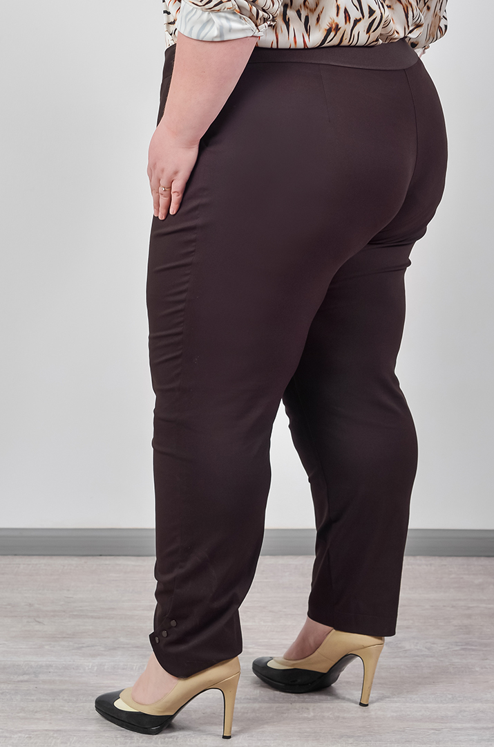 Однотонні брюки банани з акцентними манжетами великих розмірів