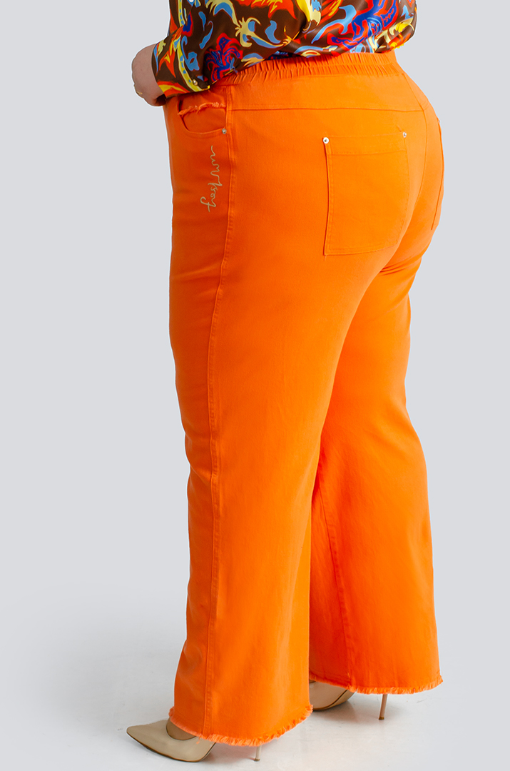 Яркие джинсы с тороками больших размеров