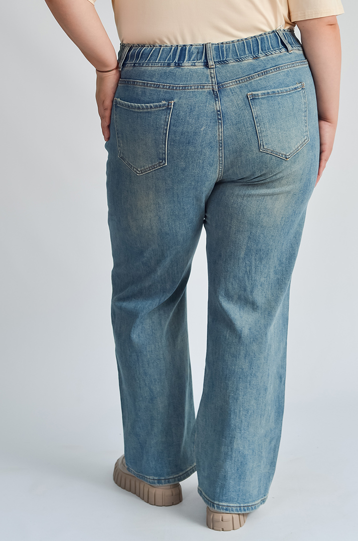 Джинси з кишенями та еластичним поясом великих розмірів