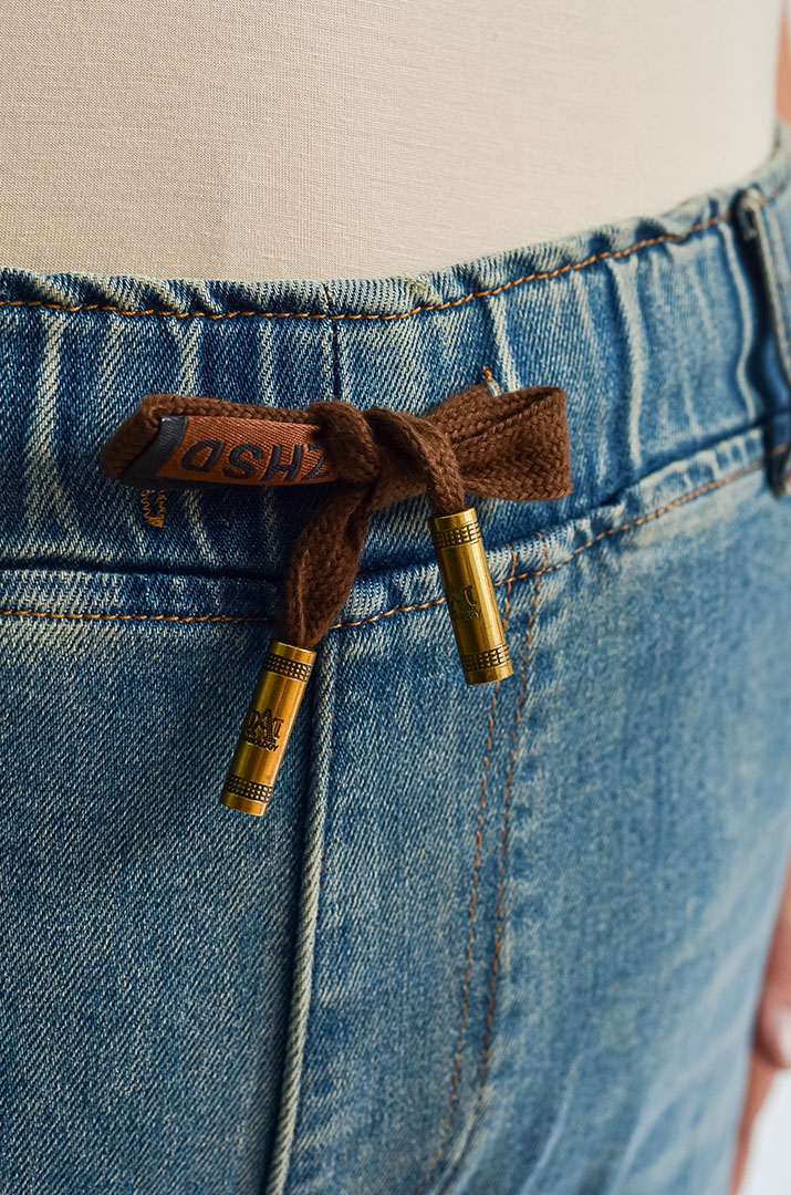 Джинси з кишенями та еластичним поясом великих розмірів