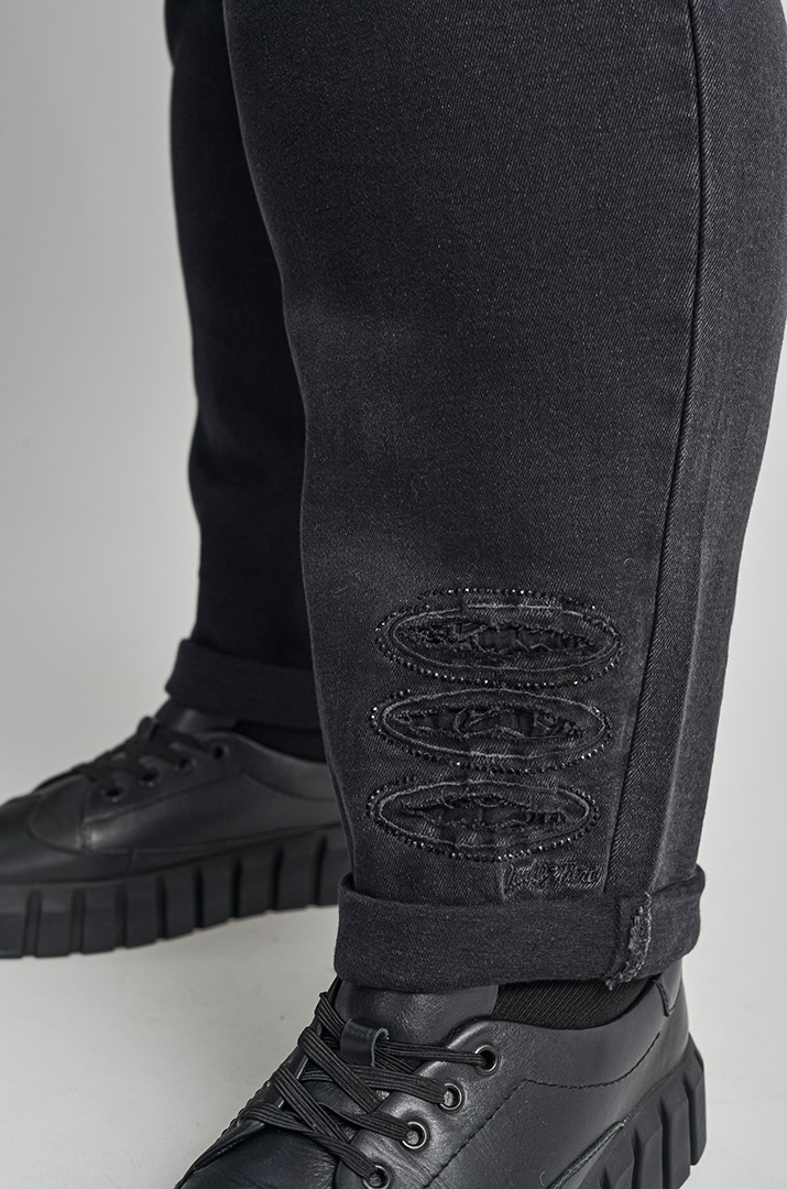 Джинси 7/8 з резинкою та стильними прорізами великих розмірів