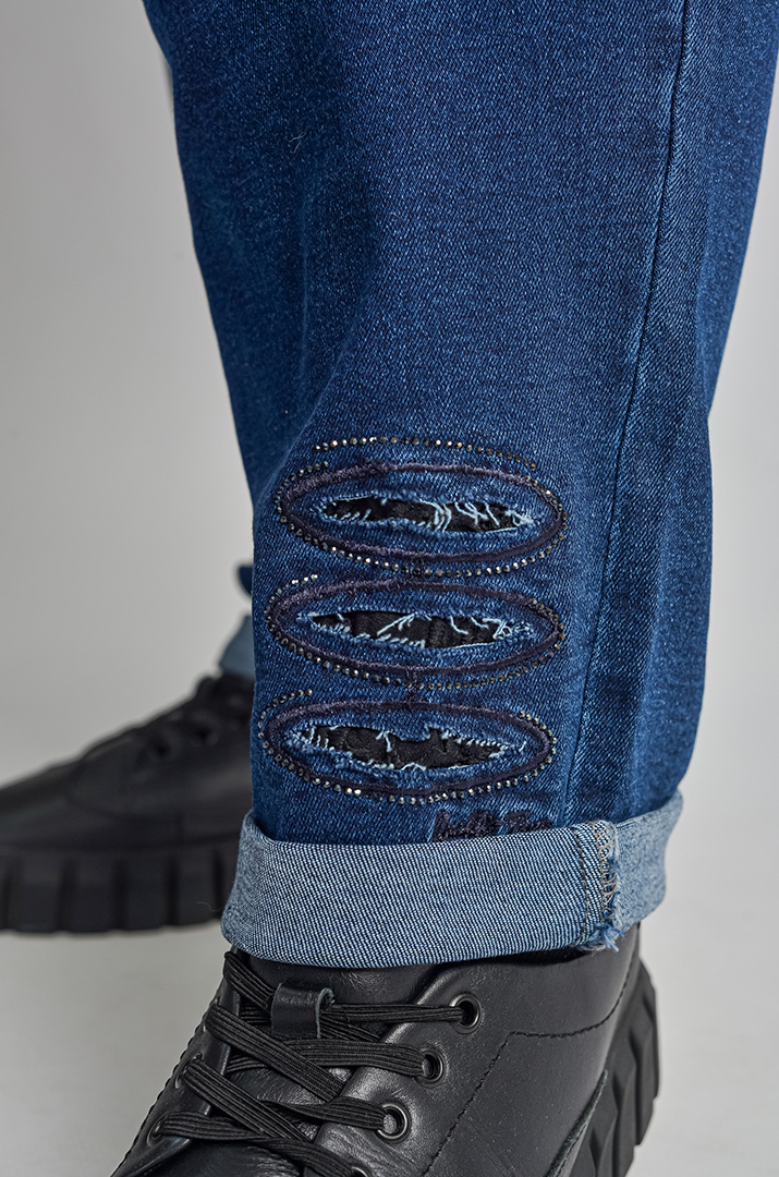 Джинси 7/8 з резинкою та стильними прорізами великих розмірів