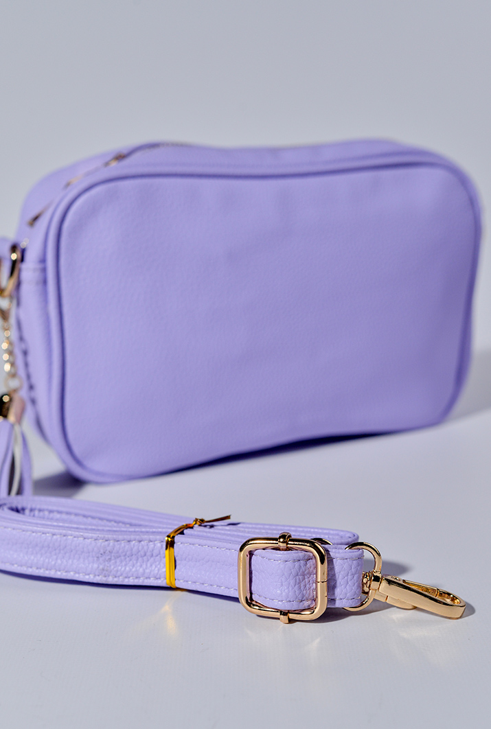 Сумка з екошкіри зі змінними ременями та з декративною китицею