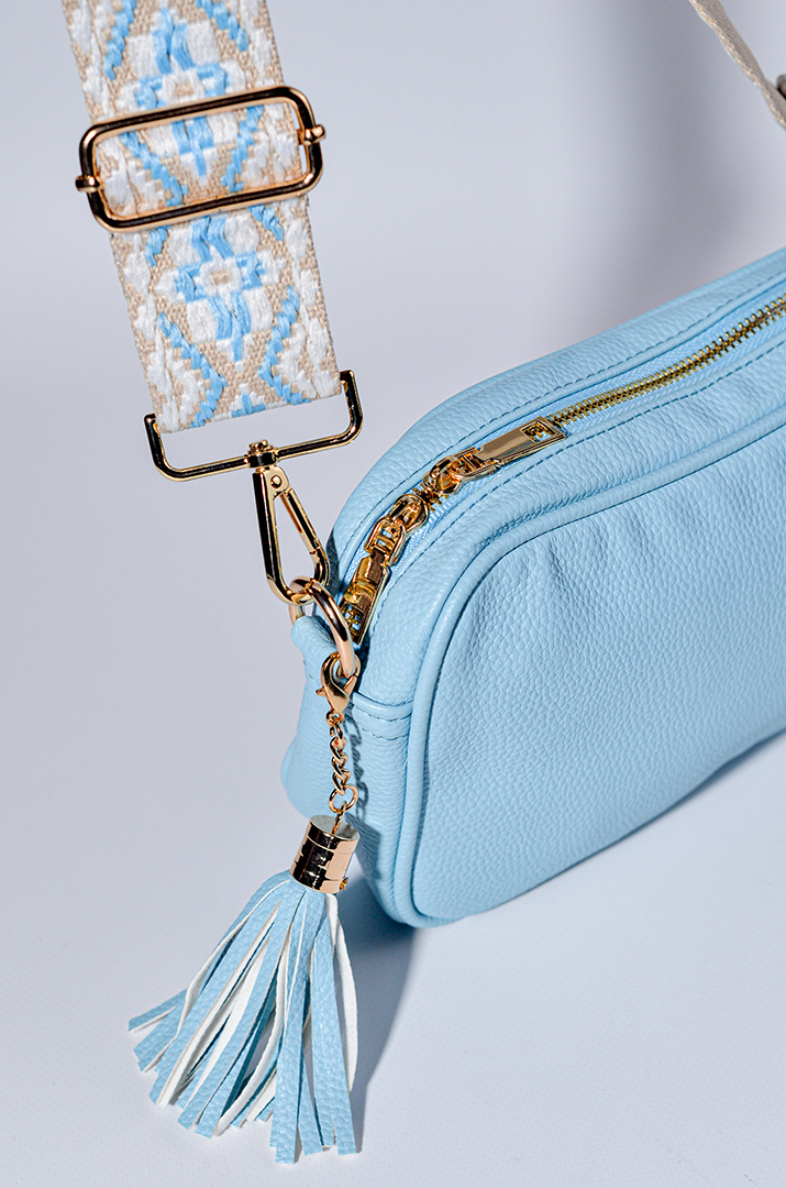 Сумка з екошкіри зі змінними ременями та з декративною китицею